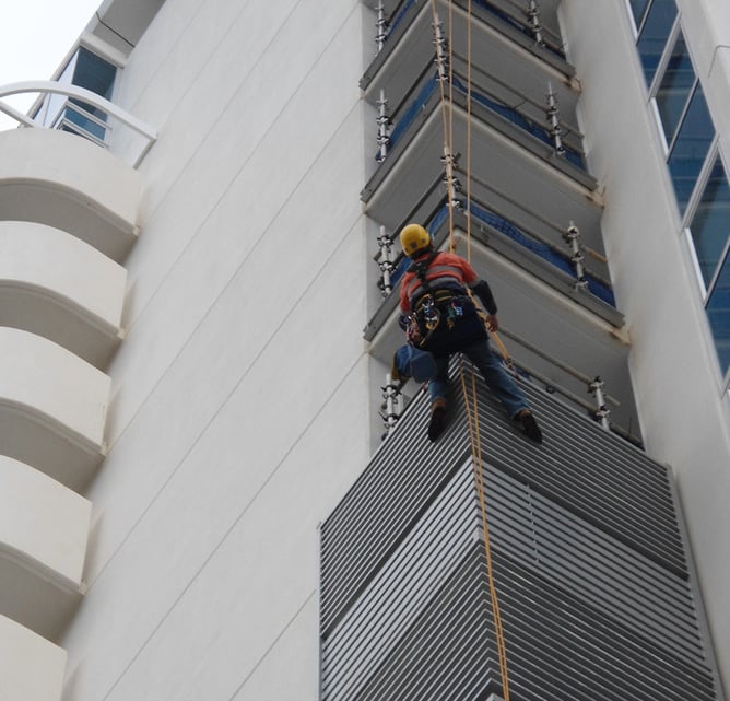 Rope access painters working on a multi-storey Surfers Paradise building